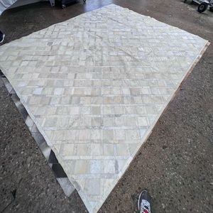 White cowhide patchwork rug